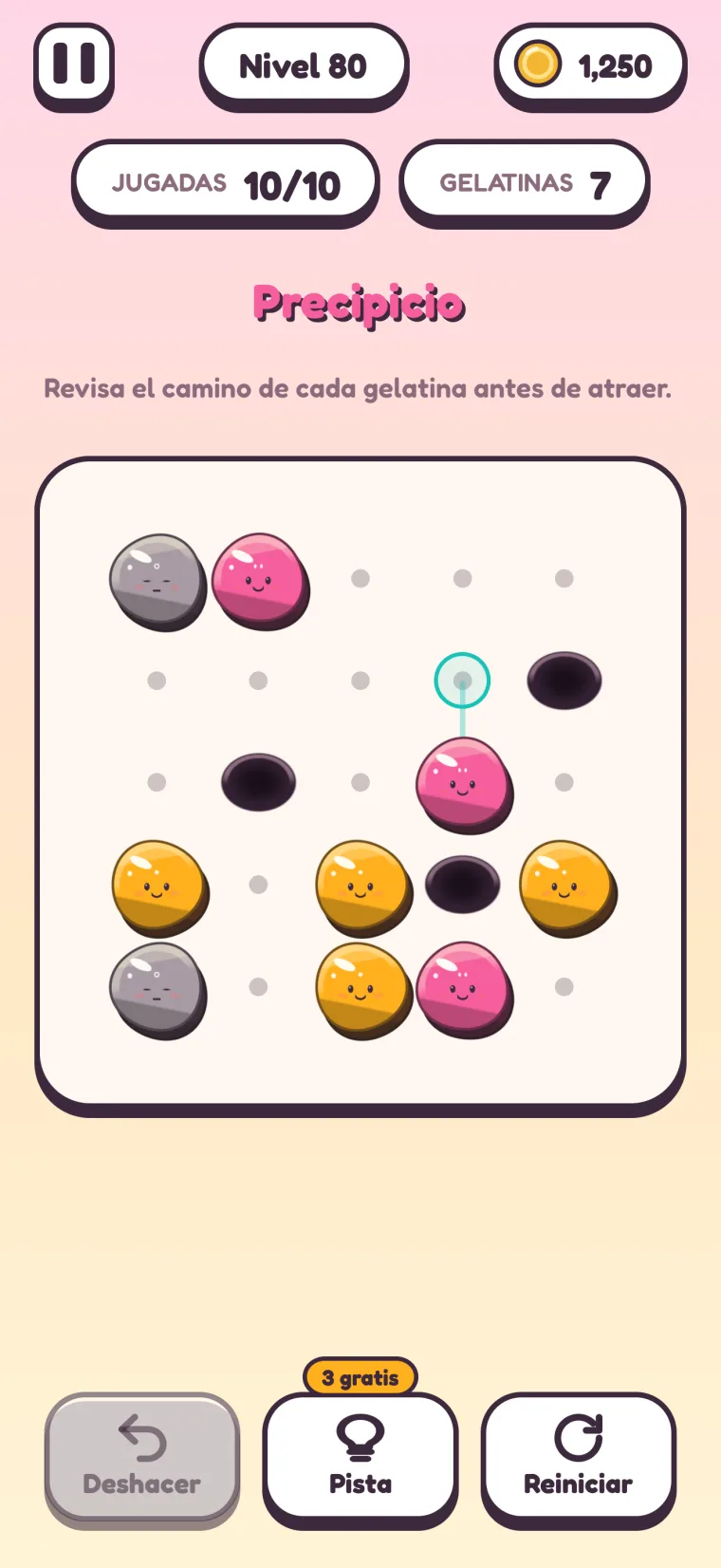 Nivel 80, “Precipicio” (“Revisa el camino de cada gelatina antes de atraer.”): tres hoyos negros en un tablero de 5×5, con gelatinas grises, rosas y naranjas alrededor y un punto de atracción marcado sobre una gelatina rosa.
